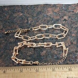 Two Gold Tone Bracelets..One Size Fits most..NEW....These are NOT the real ones!